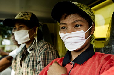 Workers at the Musim Mas plantation wearing their personal protective equipment (PPE).