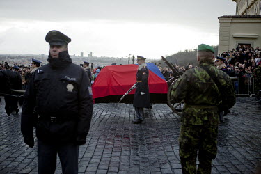 The coffin containing the remains of former president Vaclav Havel rests on a carriage, beneath a Czech flag, outside Prague Castle. A crowd of 10,00 people lined the route of the funeral cortege from...