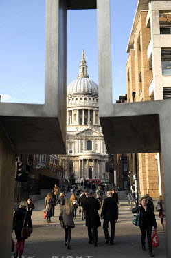 St Paul's Cathedral seen through sculptures at the junction of Peters Hill and Queen Victoria Street in the City of London.