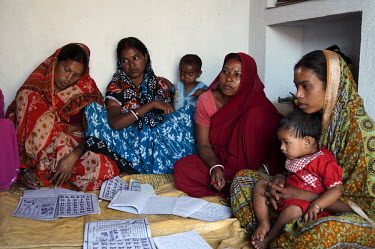 Mahato women attending a local literacy class in Pipla Village. The classes are sponsored by TSRDS (Tata Steel Rural Development Society). TSRDS is involved in various social development programmes ai...