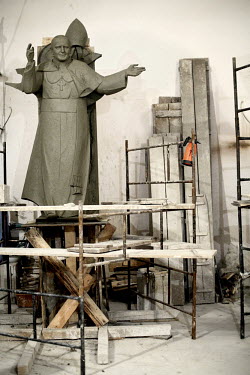 A clay figure of Pope John Paul II stands in the studios of Czeslaw Dzwigaj, a Polish artist, sculptor, and professor. The final statue, cast in bronze, will join over 70 other sculptures of the late...