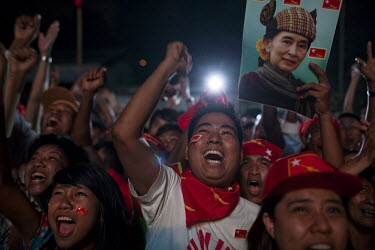 National League for Democracy (NLD) supporters celebrate outside the NLD headquarters as they watch results come in for the by-elections in Yangon.
