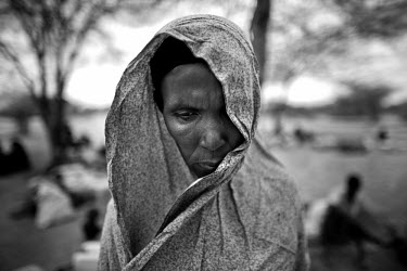 A Somalian woman waiting to enter the Dadaab refugee camp. She crossed from Somalia at the Kenyan border town of Liboi. The Dadaab camp is the largest refugee complex in the world, originally set up a...