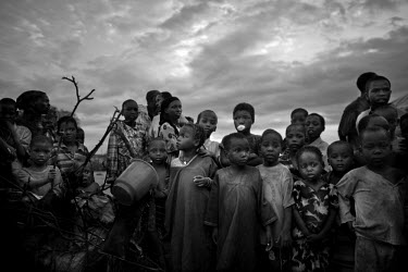 A queue of people line up for a food hand-out at the Dadaab refugee camp, the largest refugee complex in the world. The camp was originally set up at the start of Somalia's civil war in 1991, and was...