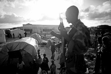 A soldier watches over Sayidka IDP (internally displaced persons) camp. The Horn of Africa is currently suffering the worst famine in 60 years and a s a result people have been streaming into the war-...
