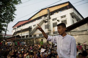 A strike leader addresses striking workers as they congregate outside the Tai Yi footwear factory in Yangon. The workers are striking over pay and working conditions. Lawyers are hoping that the refor...