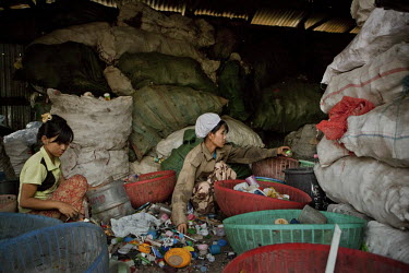 Rubbish collectors work beside a railway yard in Yangon (Rangoon).