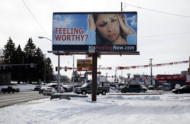 A billboard for the Latter-day Saints offering the healing properties of Christianity on the main road in the small town of Idaho Falls, Idaho.