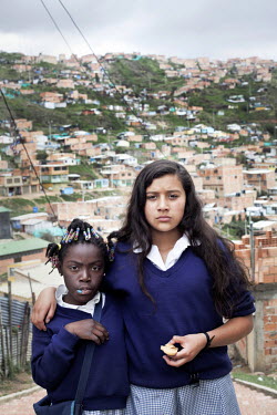 A portrait of two girls in the slum neighbourhood of Soacha, south of Bogota. Most of the people who live here are internally displaced (IDPs).This story by Mads Nissen was partly funded by a grant an...