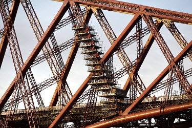 Scaffolding is dismantled on the 125 year old Forth Rail Bridge which spans the river Forth near Edinburgh. Network Rail, the operator of the rail track that leads over the bridge, has spent 10 years...