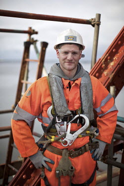 Scaffolder David 'Robo' Robertson on the Queensferry tower on the 125 year old Forth Rail Bridge which spans the river Forth near Edinburgh. Network Rail, the operator of the rail track that leads ove...