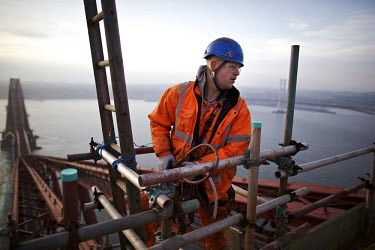 Abseiler preparing to carry out touch points from the top of the Fife cantilever on the 125 year old Forth Rail Bridge which spans the river Forth near Edinburgh. Network Rail, the operator of the rai...