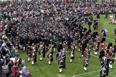 A massing of the pipes begins the Braemar Gathering, a games event held in Aberdeenshire. The event is well attended, with many tourists here to see local holidaymaker Queen Elizabeth II.