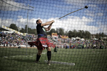 Gregor Edmunds from Scotland has been world caber tossing champion, No 1 Highland Games athlete in the world and World Highland Games champion 2007. Here, he throws a hammer at the Cowal Gathering, in...