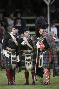 Gentlemen in full military dress at the Braemar Gathering Highland Games in Aberdeenshire.