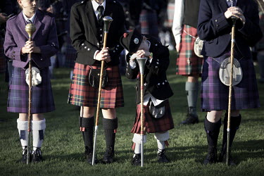 A young pipe major awaits the end of the 'Massing of the Pipes', the finale to the Cowal Gathering, Scotland's largest Highland Games in Dunoon, Argyl and Bute.