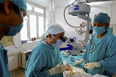 Doctors perform surgery on a patient with cataracts at the GETA eye hospital.