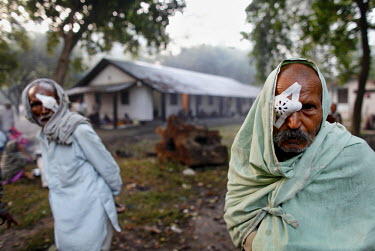 61 year old Malti Prashad and 62 year old Puttu Lal await the removal of their bandages after having an operation at the GETA eye hospital. The hospital is too crowded to accommodate them.