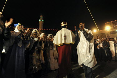 Eritrean asylum seekers who reside in Tel Aviv, celebrate the Coptic Christmas at Mangar Square in Bethlehem, West Bank.