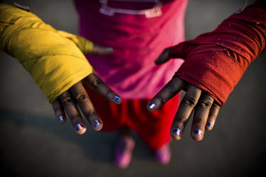 The hands of 17 year old boxer Claressa 'T-Rex' Shields. She has painted her nails in the colours of the US flag during her training at FWC Berston Gym in Flint, Michigan. After boxing for six years,...