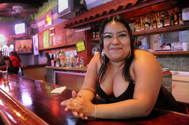 A waitress at Bar El Paraiso, a  place with a questionable reputation.