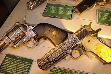 Diamond inlaid and gold plated pistols and revolvers confiscated from arrested cartel leaders and big criminals in a cabinet at the drugs museum at the headquarters of the Mexican Army.