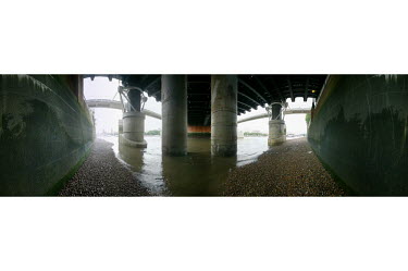 A 360 degree view of Hungerford Bridge from the south bank of the River Thames in the London Borough of Lambeth. To the left in the distance is the Houses of Parliament and the Millennium Bridge is al...