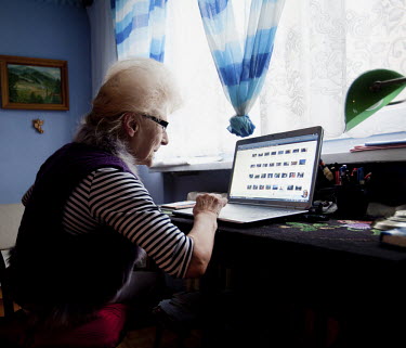 Wika Szmyt a 74 year old DJ, the oldest in the country, uses her laptop at home before setting out to the Bolek Club. There she runs a twice weekly club night, which is mainly frequented by pensioners...