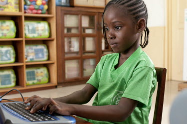 A schoolgirl at the North Ridge Model Kindergarden uses a computer in a classroom.