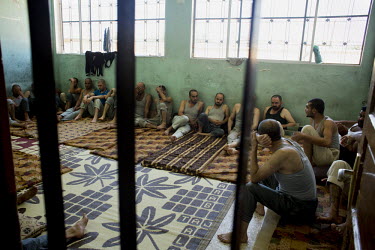 Pro-regime prisoners are seen in a school being used by the Free Syrian Army (FSA) as a prison in Mari.