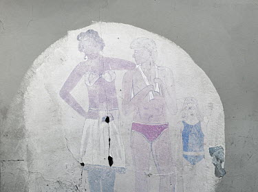 A mural on the side of a house depicting a mixed race couple with a white child. Graeme Williams' pictures of the environments occupied by some of South Africa's poorest people focus on the interiors...