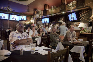 Democratic voters in Lake Worth, Florida watch President Obama and Mitt Romney partake in the first presidential debate. Romney was credited with winning on style, if not on substance. In the days fol...