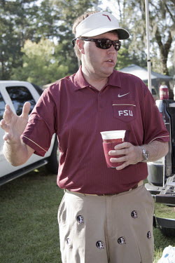 Jeffrey Buddiedub, a former Florida State University (FSU) student, at a 'tailgate party' prior to a big FSU football game. Jeffrey works in IT for Blue Cross (medical insurance) in Washington D.C. Ta...