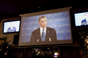 Democratic voters in Lake Worth, Florida listen to President Obama during the first televised presidential debate, between the president and Republican candidate Mitt Romney. Romney was credited with...