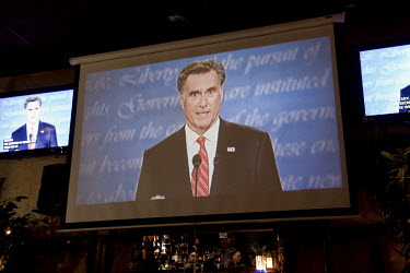 Democratic voters in Lake Worth, Florida listen to Republican candidate Mitt Romney during the first televised presidential debate, between Romney and President Obama. Romney was credited with winning...