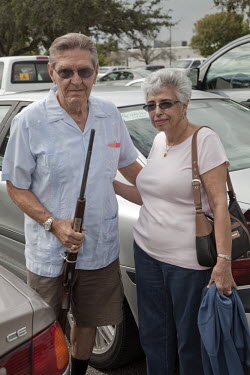 Frank and Florence Watson, former New Yorkers who have retired in S. Florida, leaving the West Palm Beach gun and knife show. Talking about the upmcoming presidential election Frank says: 'The Obama a...