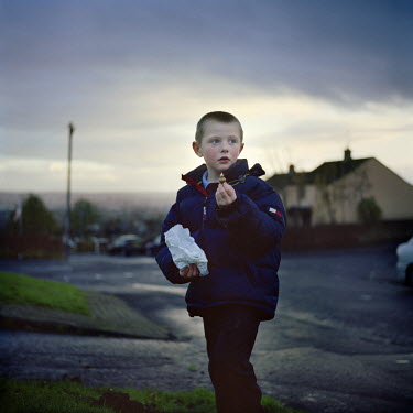 A young boy in Ballysillan estate plants flower bulbs as part of the final re-imaging effort in the area. Re-imaging areas with violent and intimidating reminders of the past has been a struggle for m...