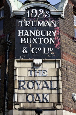 Old signage outside the Royal Oak Public House on Columbia Road Market, Hackney, London.