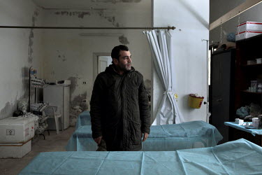 Dr Rami, who lived in Leicester in the UK until recently, stands in the basement of the hospital where he works in the town of Salma near the front line between the Free Syrian Army and government for...