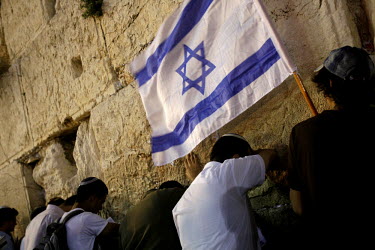 Israeli youths pray at the Western Wall during celebrations on Jerusalem Day, 21 May. Thousands nationalist Israelis marched through the city in celebration of its reunification in 1967.