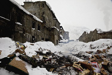 Rubbish strewn around the crumbling buildings of a former iron-processing plant in Kirovsk City. Since the collapse of the Soviet Union, many heavy industries in the Arctic have closed as it no longer...