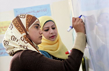 Girls in an English class. The Ramtha facility has been opened by the Government of Jordan to receive Syrian refugees. UNICEF is providing psycho-social support for the children in the vicinity. To da...