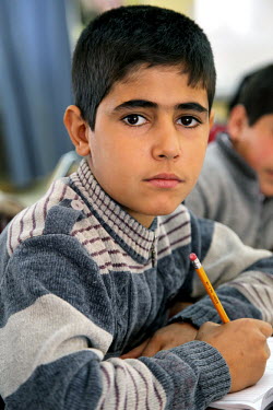 A Syrian refugee boy at an English class. UNICEF and partner organisation, the Jordanian Hashemite Fund for Human Development (JOHUD), run remedial education classes for vulnerable Syrian children. In...