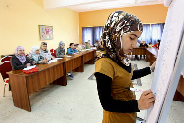 14 year old Marah Alabrch, with other girls in a math class. UNICEF and partner organisation, the Jordanian Hashemite Fund for Human Development (JOHUD), run remedial education classes for vulnerable...
