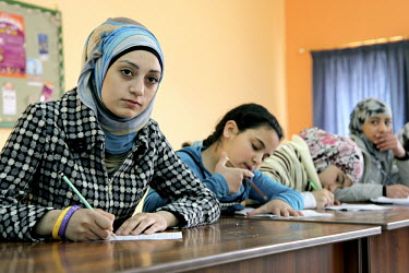 15 year old Nuha Abdul Haque, with other girls in a math class. UNICEF and partner organisation, the Jordanian Hashemite Fund for Human Development (JOHUD), run remedial education classes for vulnerab...