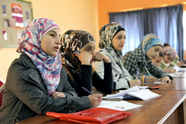 12 year old Aya Najjar, with other girls in a math class. UNICEF and partner organisation, the Jordanian Hashemite Fund for Human Development (JOHUD), run remedial education classes for vulnerable Syr...