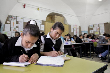Palestinian girls study in a class at Silwan Girl's School in Silwan, a densely populated East Jerusalem neighbourhood located right outside Jerusalem's Old City Wall, where children are affected by d...