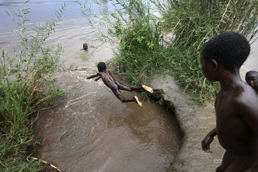 Children play in a river beside the road from Bujumbura to Bururi Province. This area is in one of the four provinces in Burundi are severly affected by Neglected Tropical Diseases such as Onchocerchi...