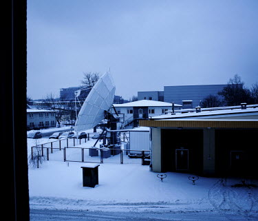 Satellite dish at the studios of Polish TV in the snow.
