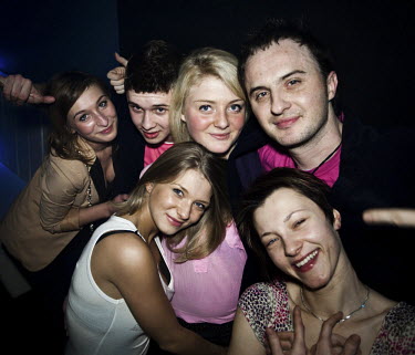 Performers of After Party, a band that plays disco polo music, pose with their fans at the Eden club in Trojany near Warsaw. Disco polo is a type of dance music which originated in rural areas of Pola...